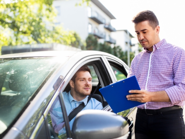 Man Inside a Car Talking to an Agent