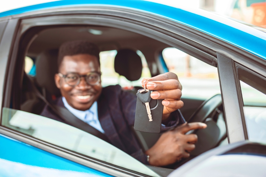 Man Driving a Blue Car